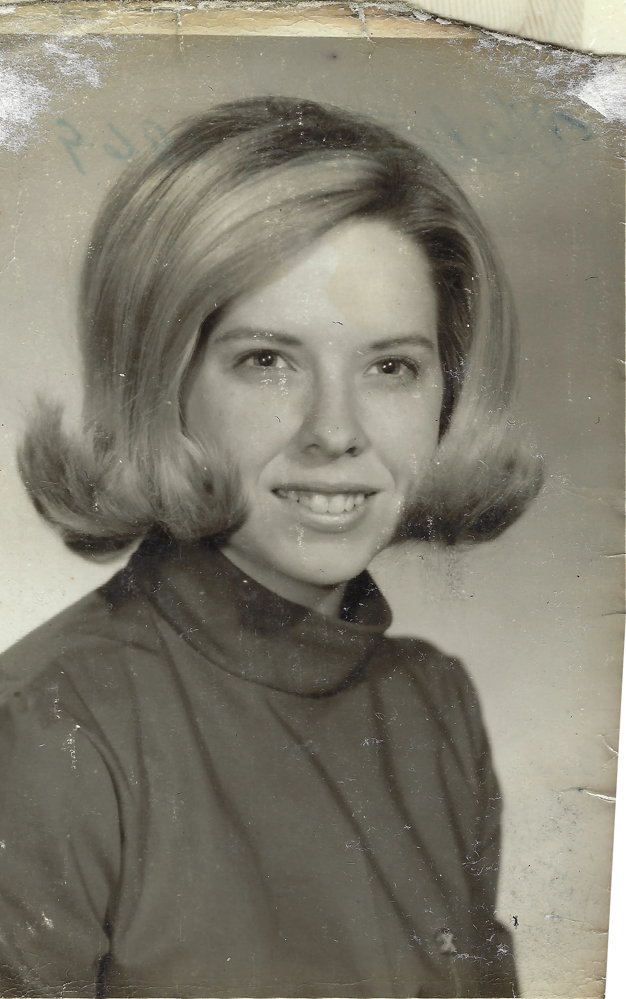 A portrait of Cacky (b.1947) with a blonde flip hairstyle in a dark turtleneck, around 1964