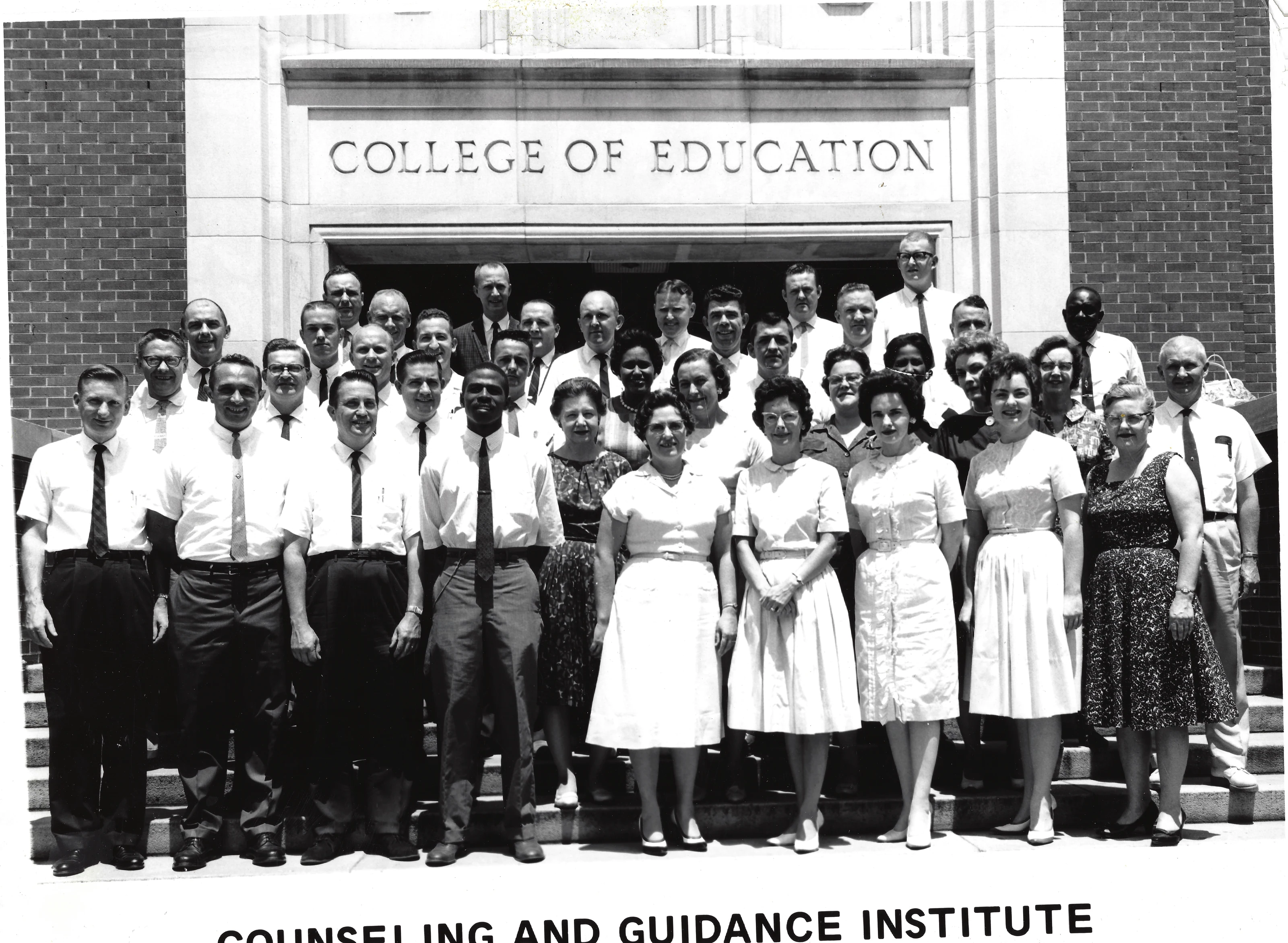 A large group photographed on the steps of the College of Education for a Counseling and Guidance Institute, Gruzel (b.1924) among them, around 1961