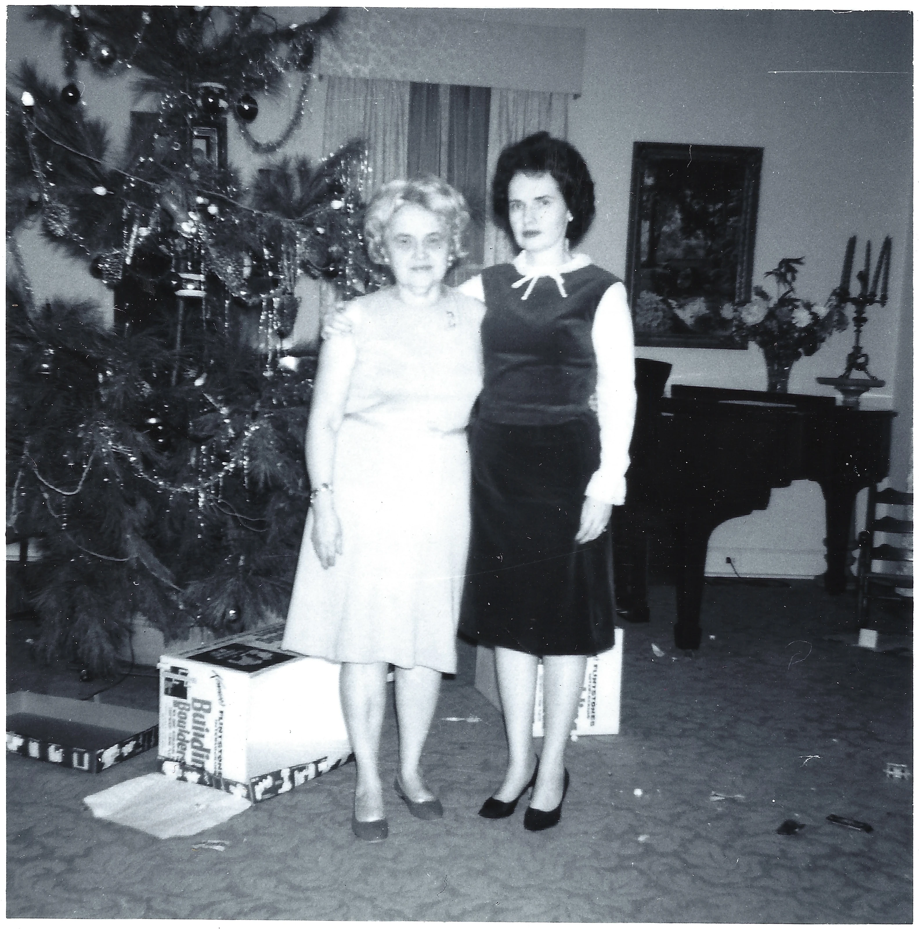 Gruzel and Mama Percy standing together beside a decorated Christmas tree; the print is lab-stamped January 1967