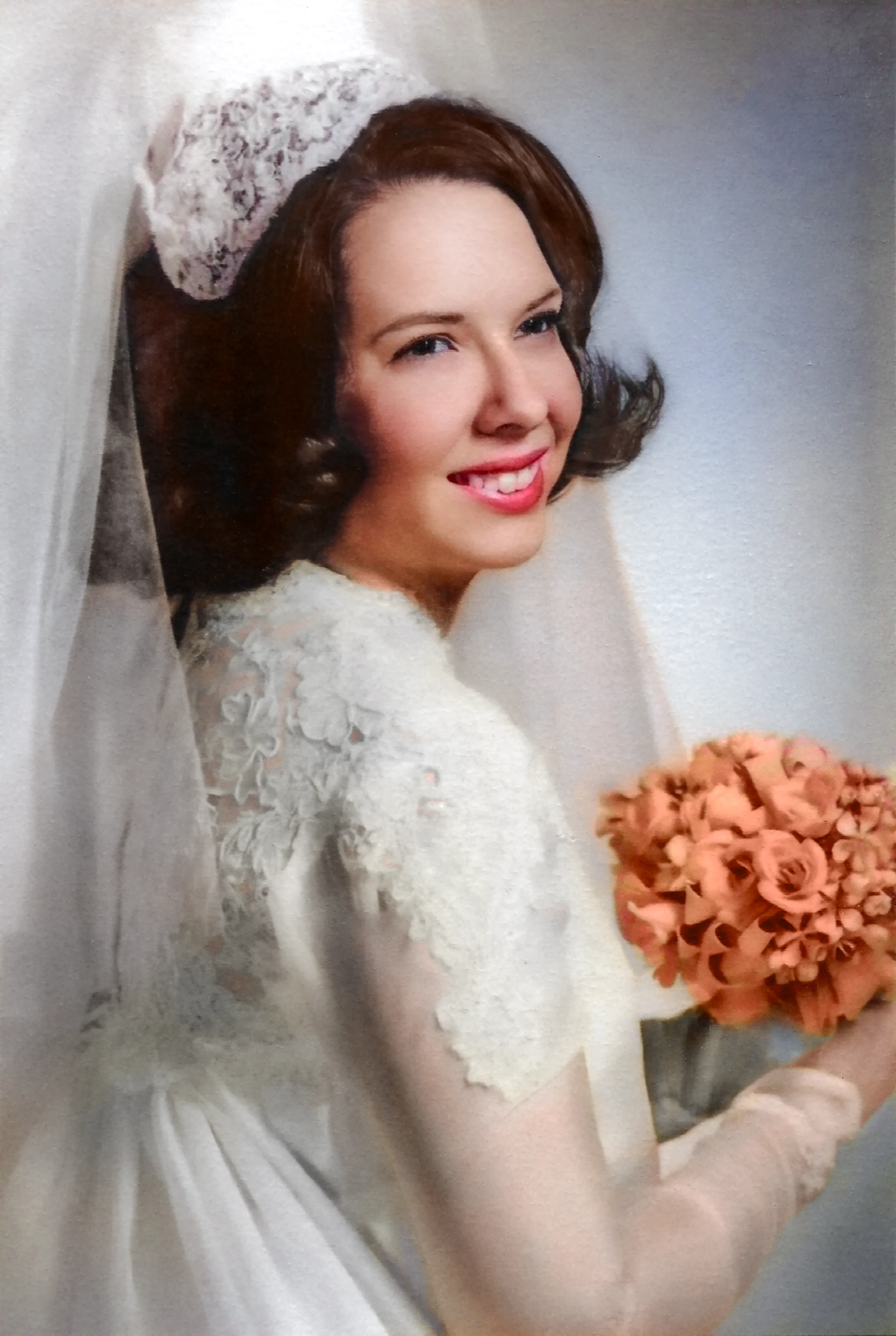 Cacky poses in her wedding gown and veil in 1969