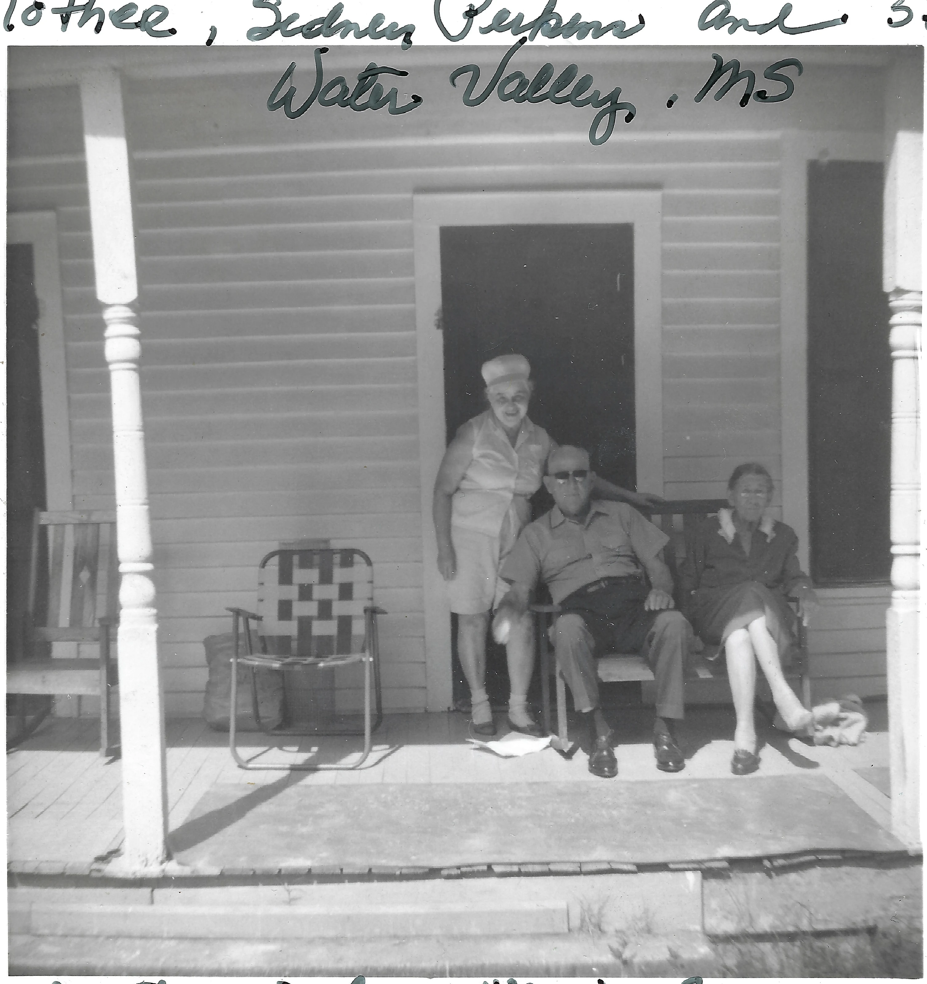 Mama Percy (Catherine Fleming) with family on a clapboard house porch in Water Valley, Mississippi, 1956