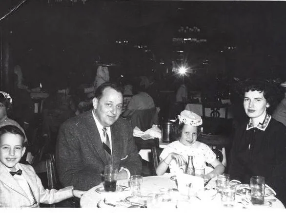 The Wilkins family at a restaurant table, 1956